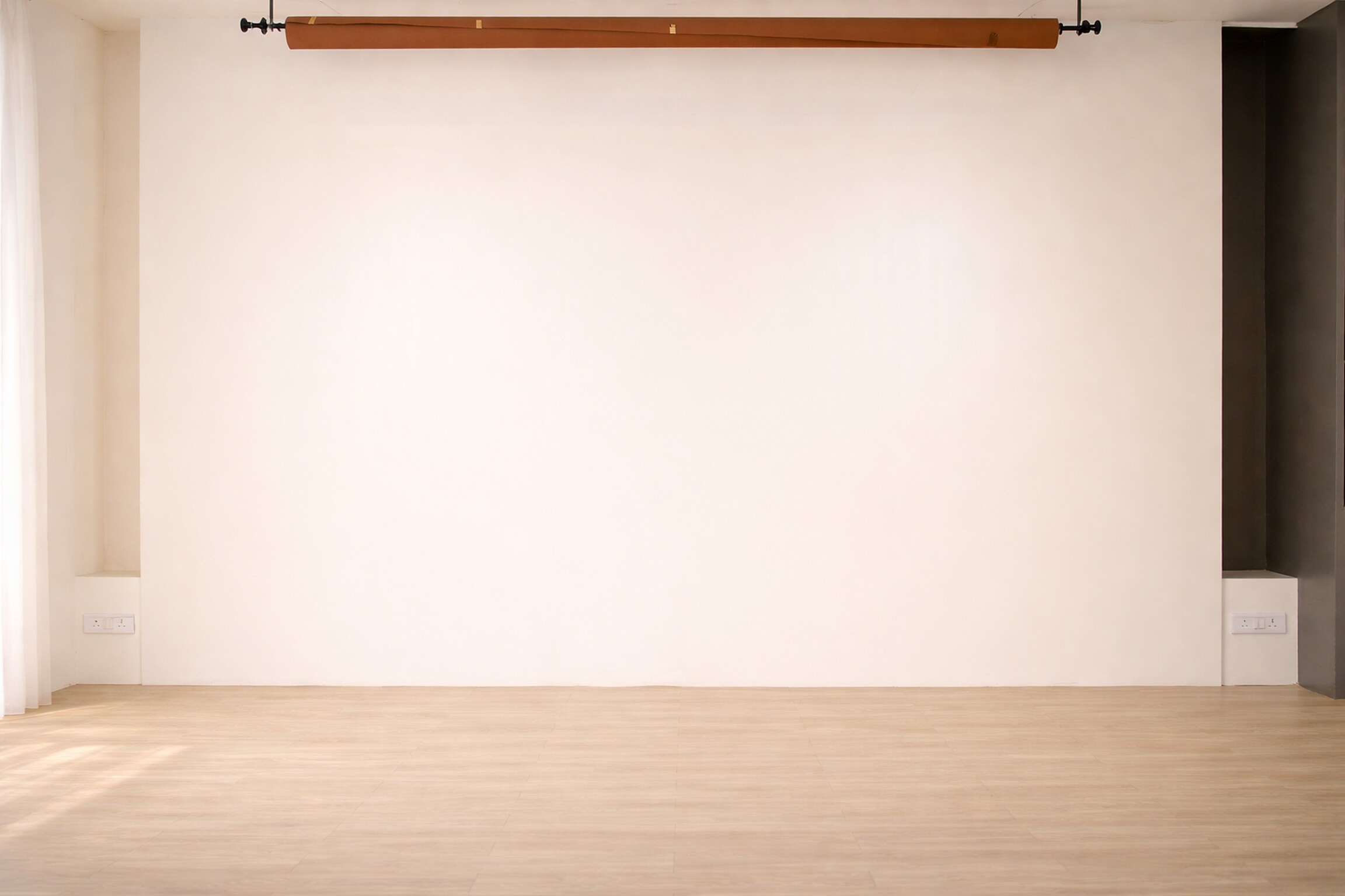 The Blank Space — the bare 15 ft wall with its backdrop roller