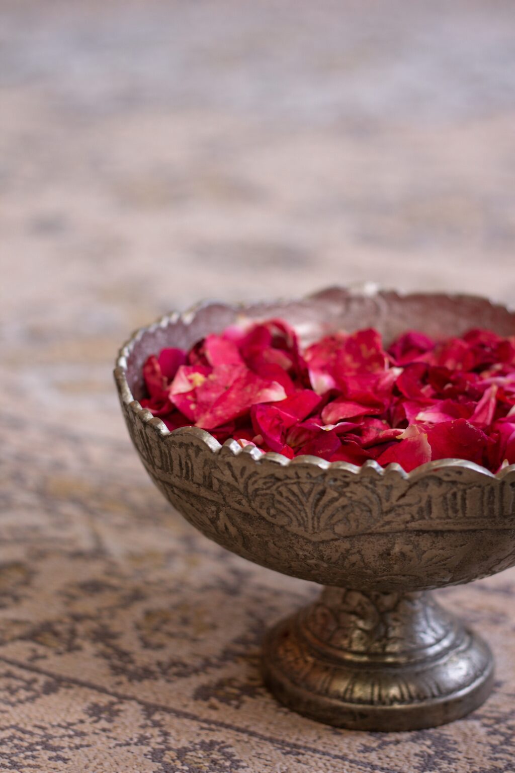 Rose petals in a carved urli