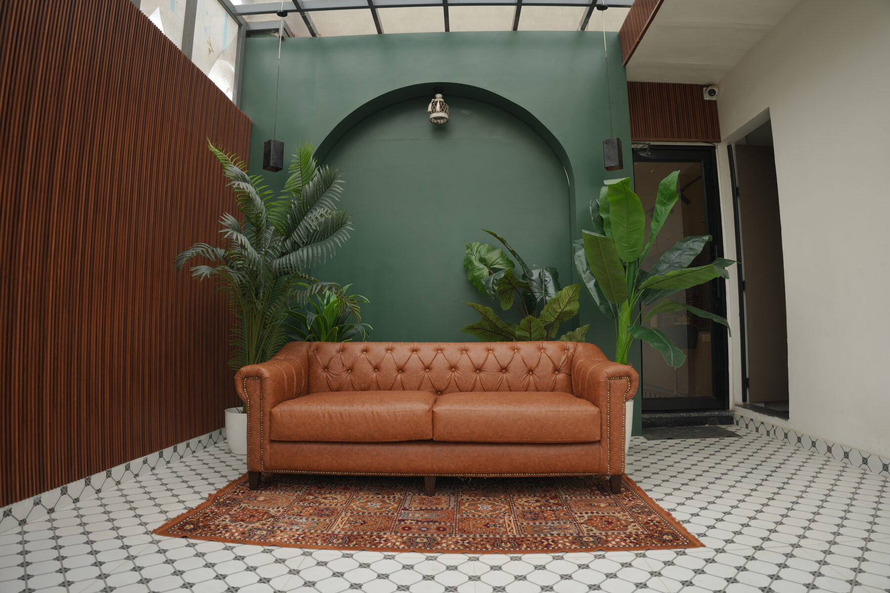 The Palm — natural light set with palms and soft shadows